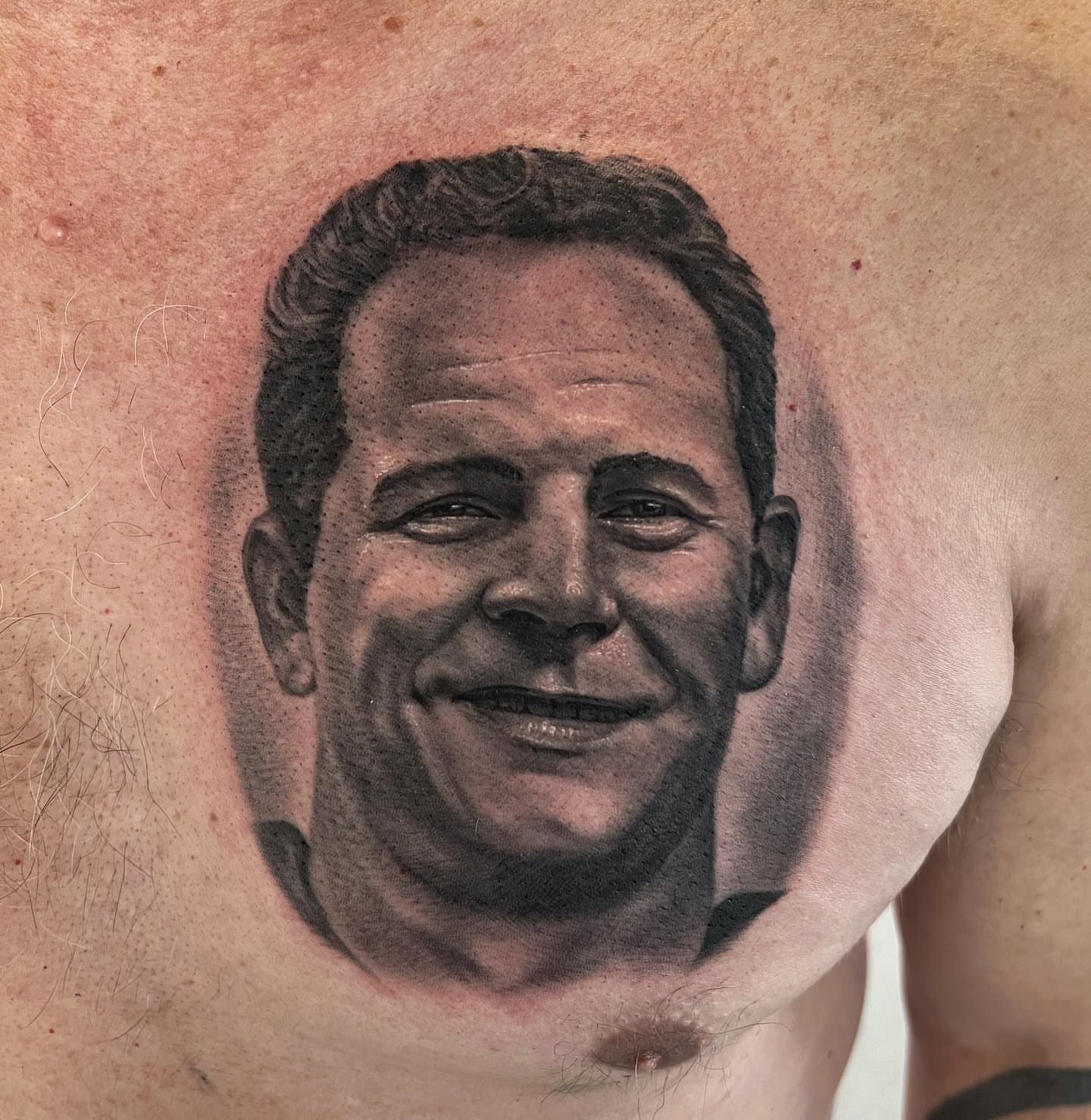 Portrait realism tattoo on the chest by Rusty Dornhecker, Columbus, Ohio