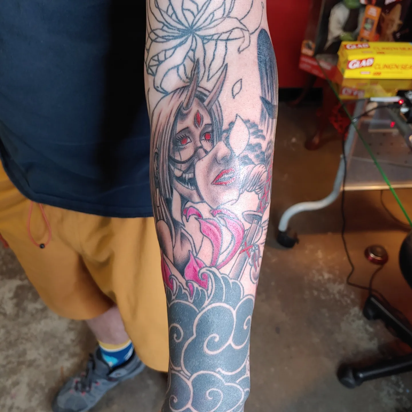 Anime character anime tattoo on the forearm by Gene Britton