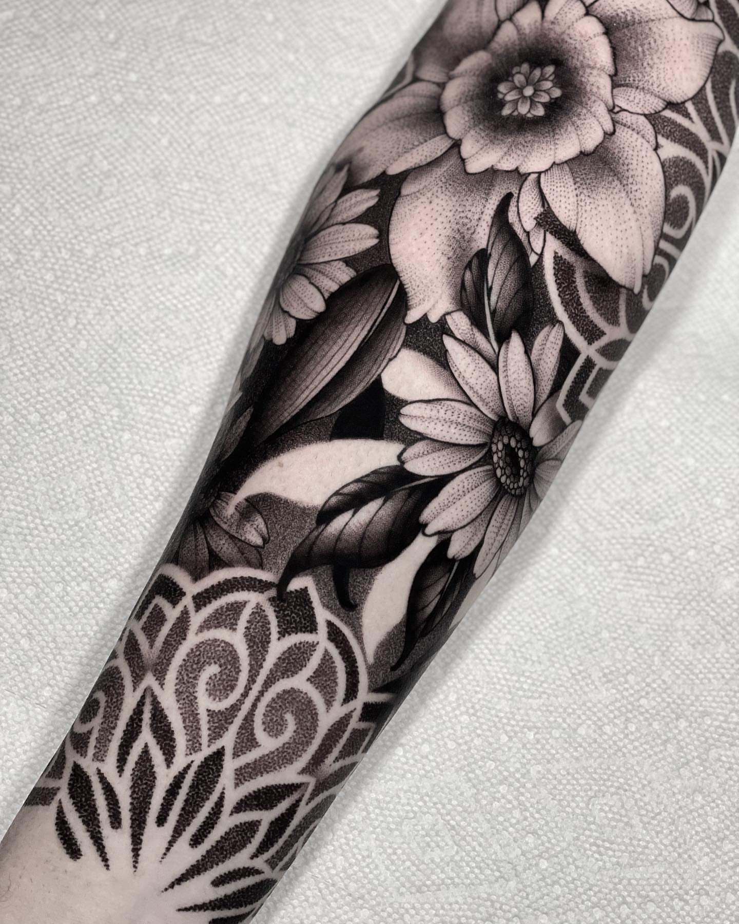 Floral bouquet dotwork tattoo on the forearm by San Diego