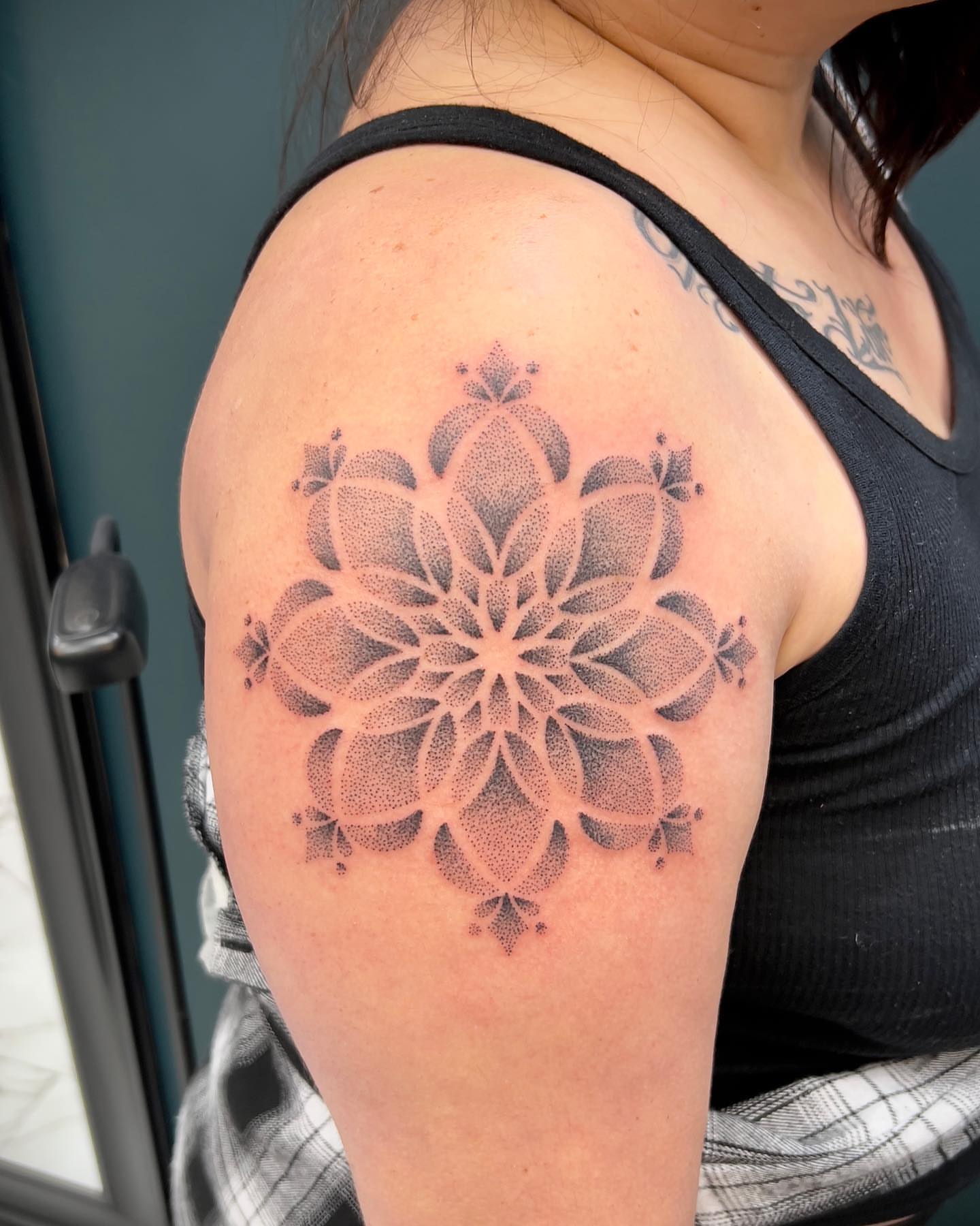 Lotus flower dotwork tattoo on the shoulder by Tattoos by Katherina, Willoughby, Ohio