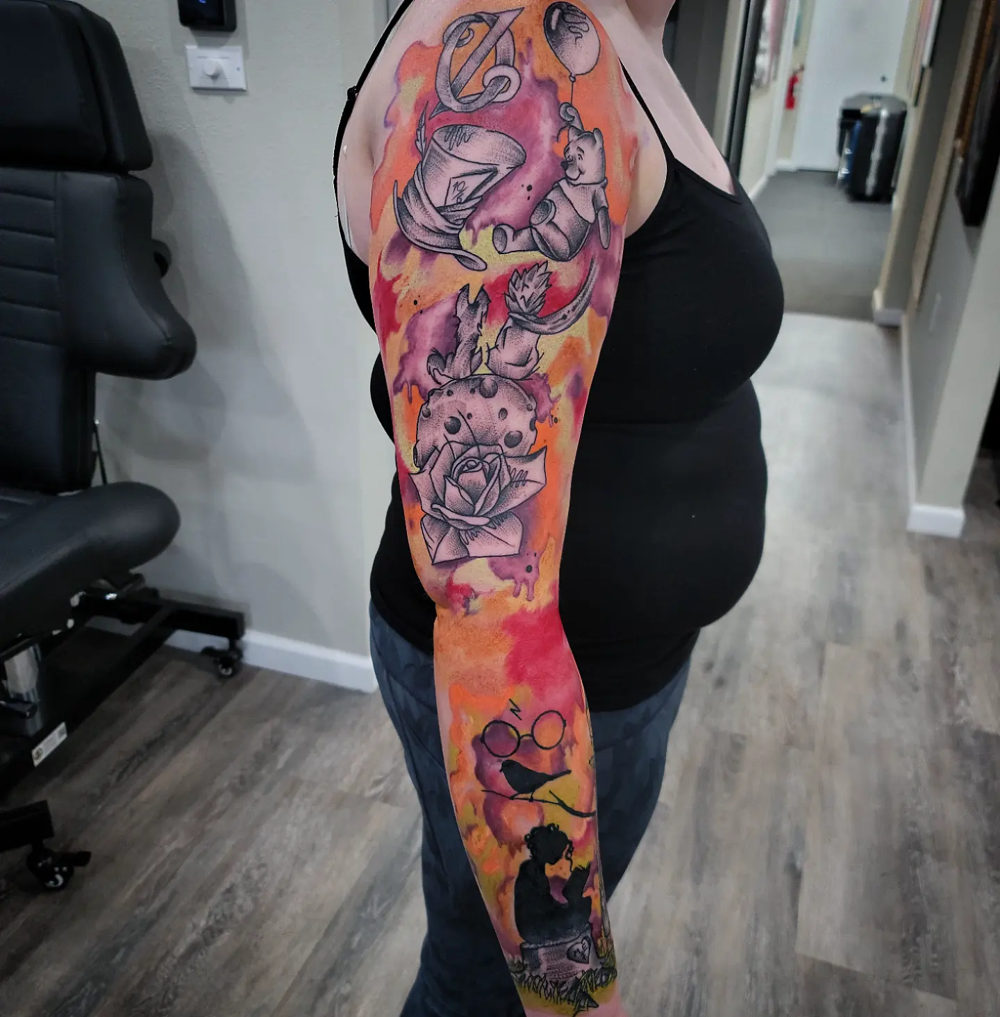 Harry Potter-themed sleeve new school tattoo on the upper arm by Dick Eckman