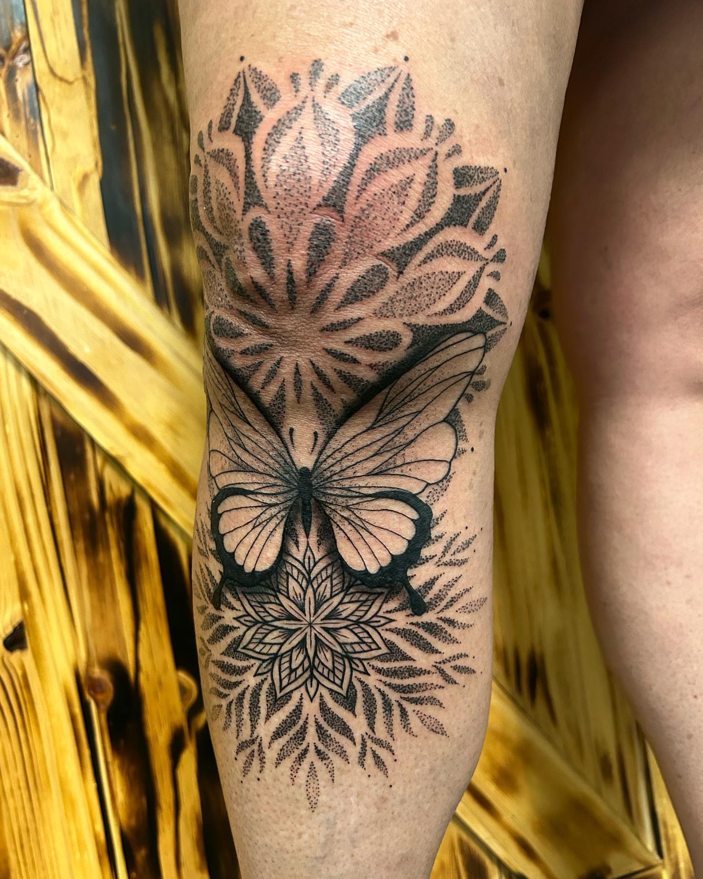 Butterfly and floral mandala dotwork tattoo on the forearm by ππππππ ππππππ