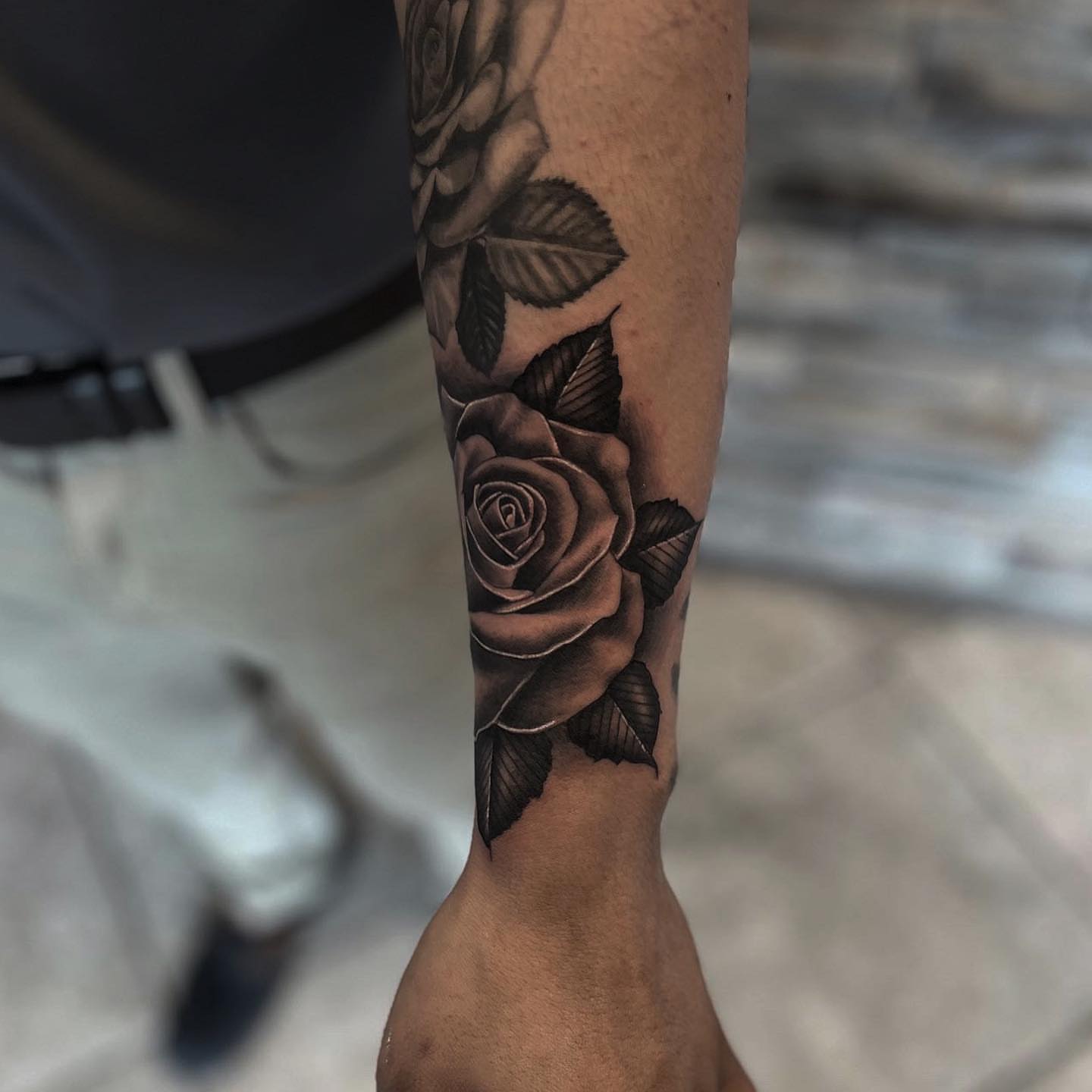 Roses black and grey tattoo on the forearm by Aaron Carey, Salem, Oregon