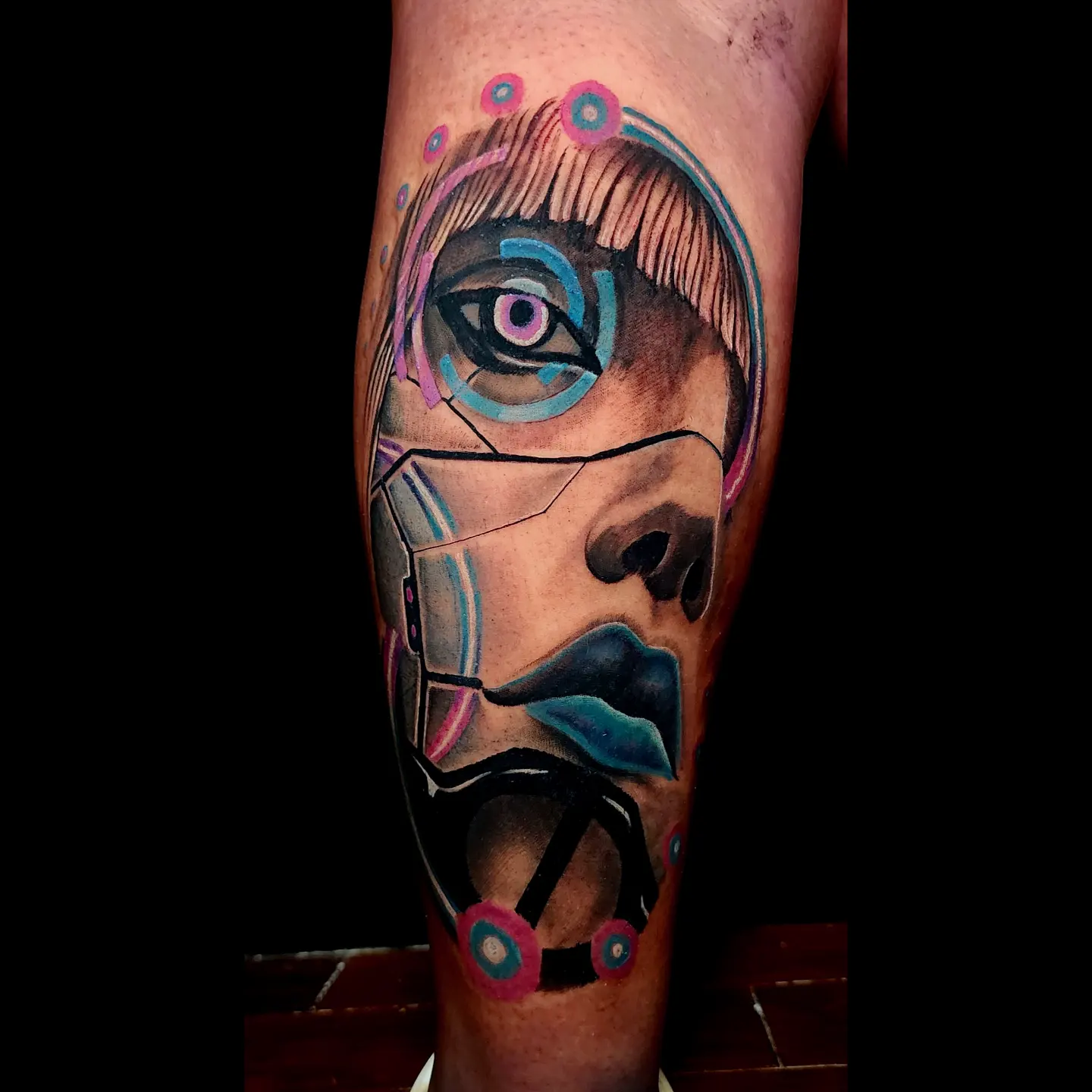 Cyborg face realism tattoo on the forearm by Tyler Cromwell