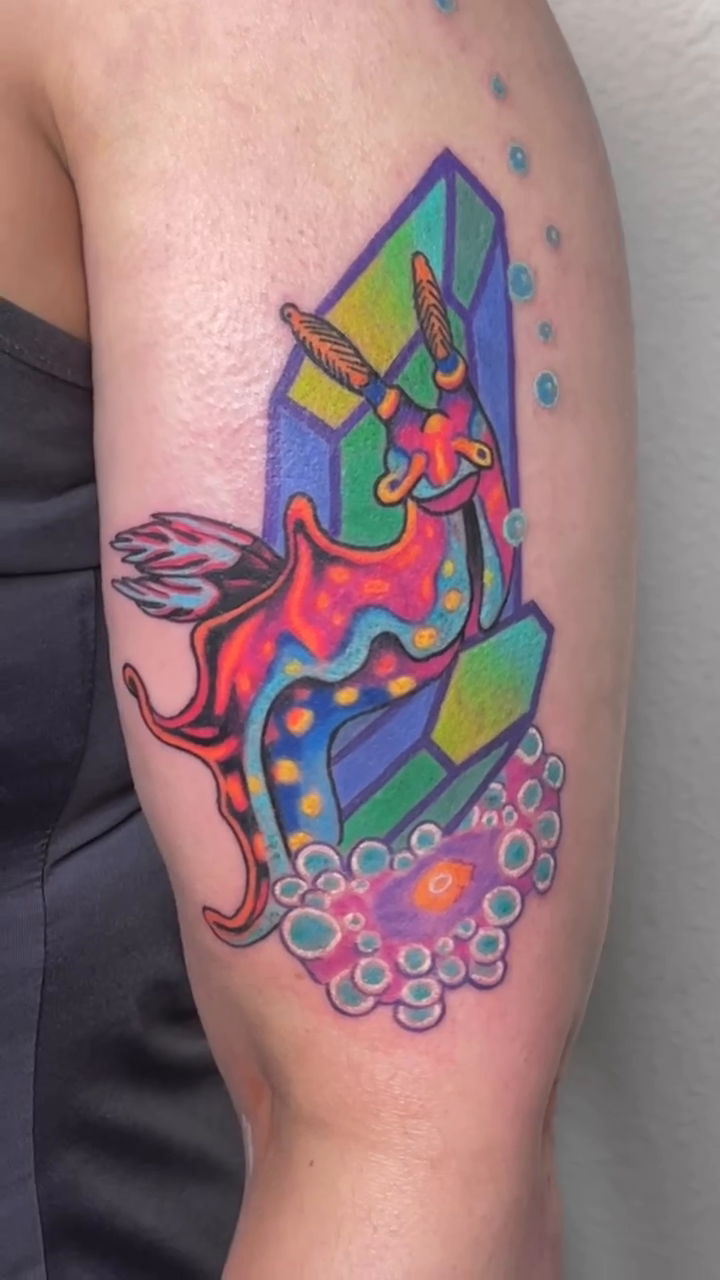 Sea slug and crystals neo-traditional tattoo by Sienna Coppa