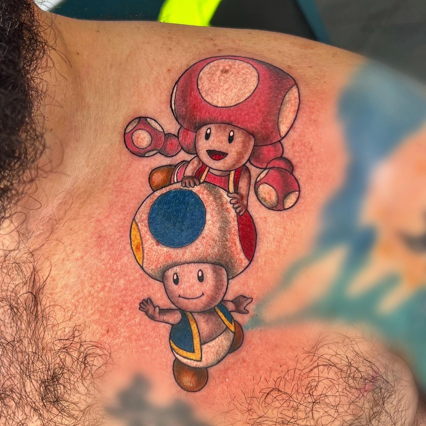 Toad characters realism tattoo on the chest by Nikki Malfitano