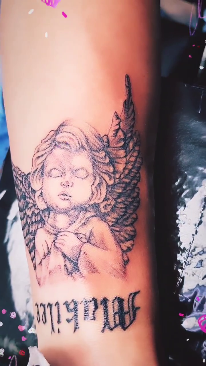 Cherub with wings and text realism tattoo by André Brazil