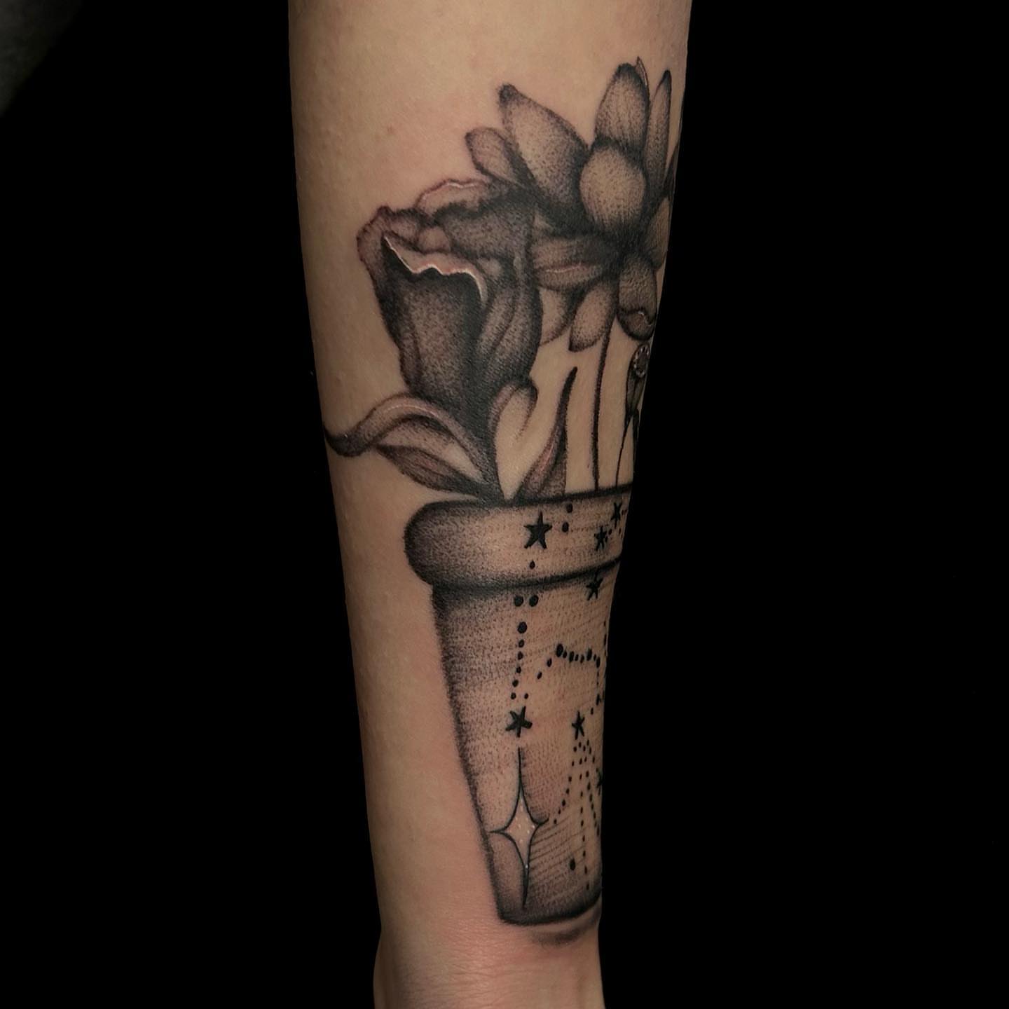 Flowers in vase dotwork tattoo on the forearm by Anahi