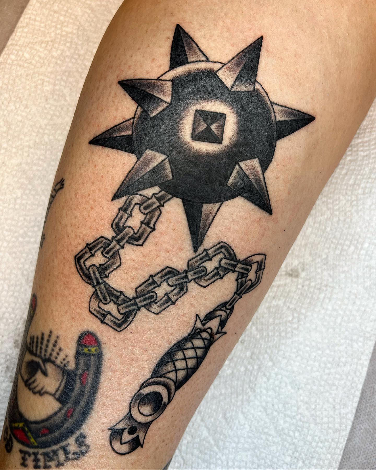 Chain and spiky symbol black and grey tattoo on the forearm by Pedroux M.