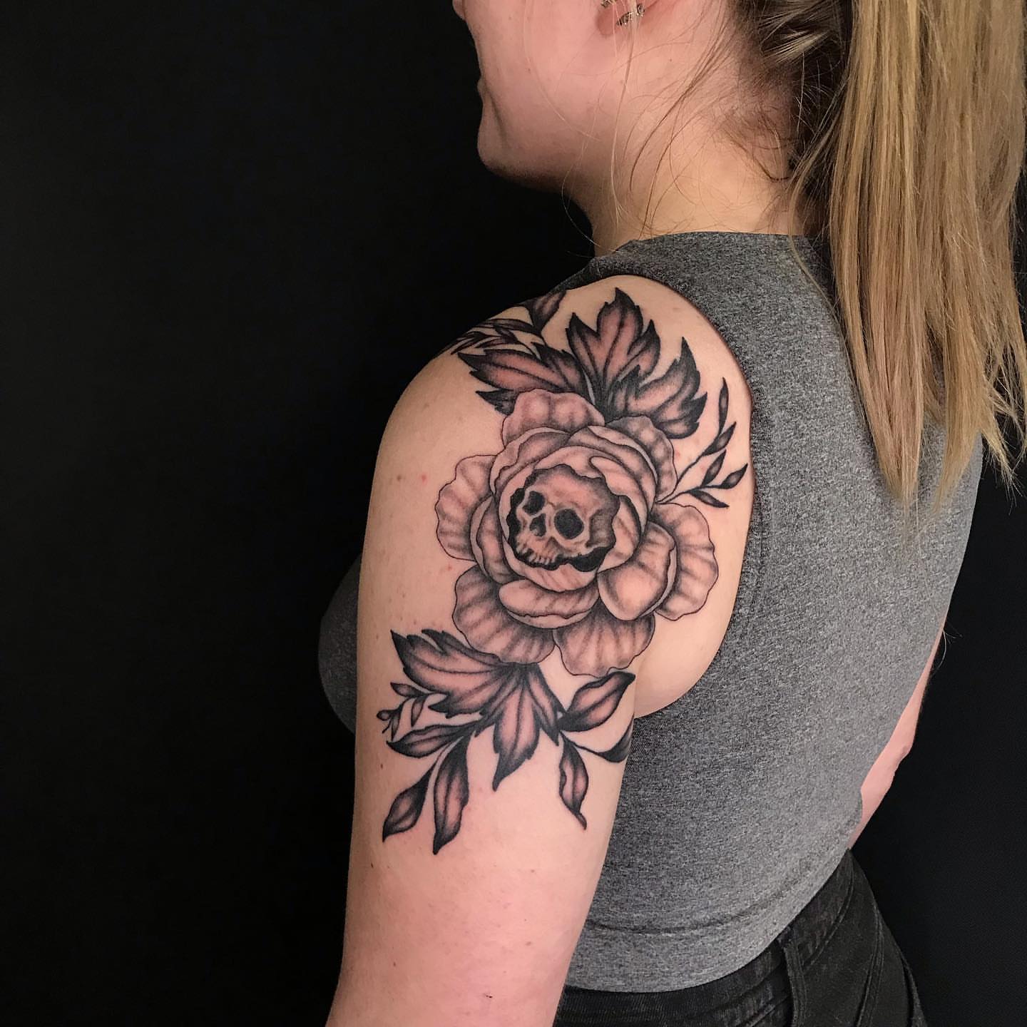 Rose with skull realism tattoo on the shoulder by Hildur Blom, Seattle, Washington