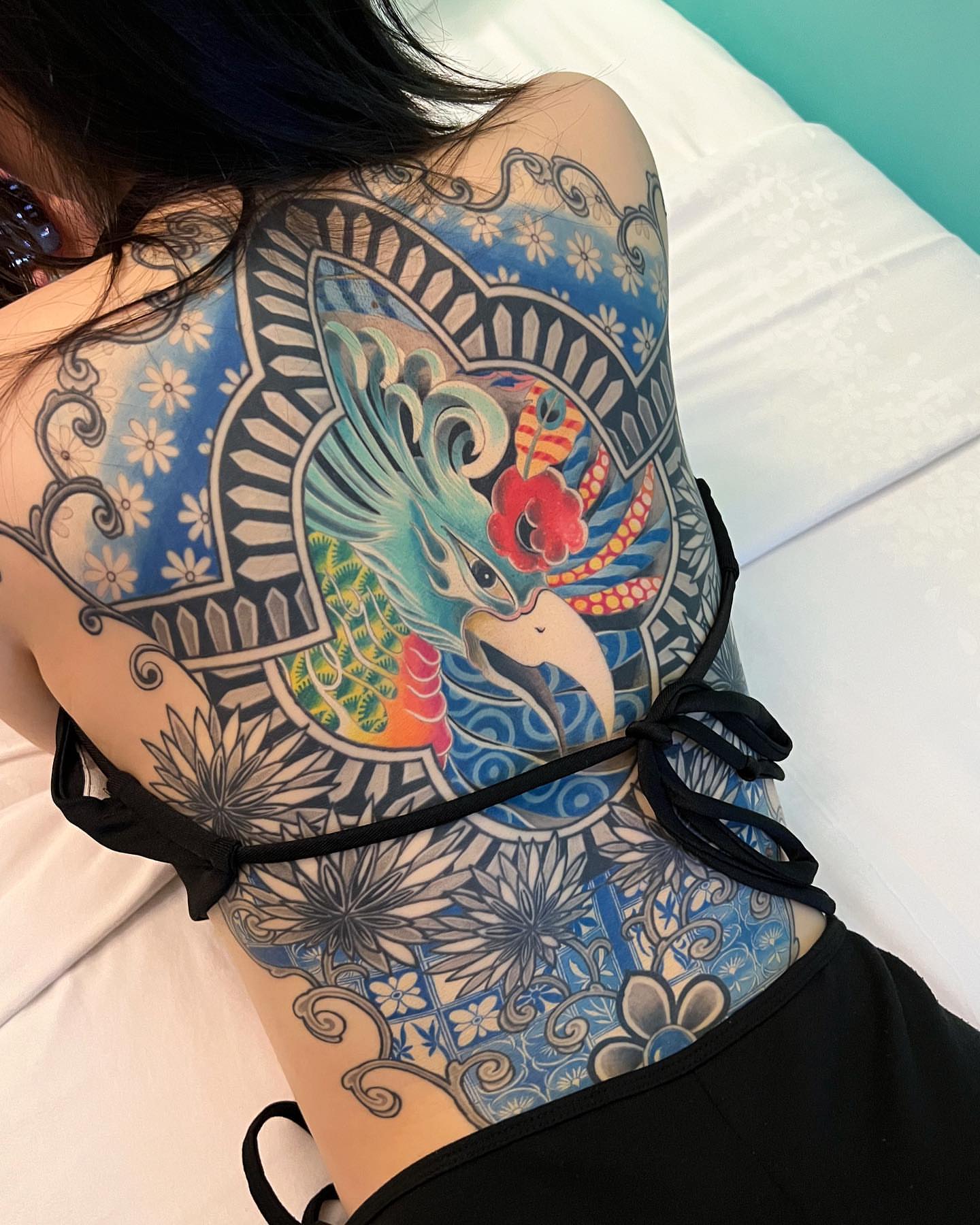 Bird and floral japanese irezumi tattoo on the back by Swani