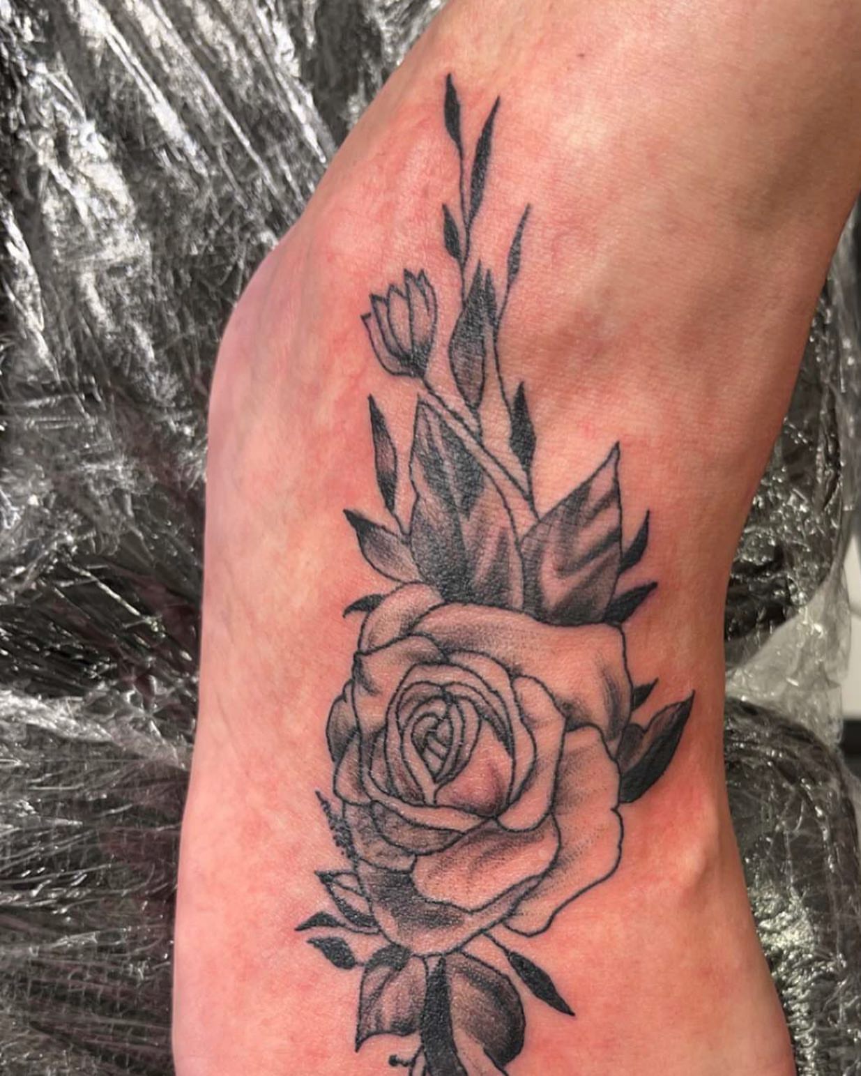 Rose black and grey tattoo on the forearm by Frankie Sodapop Plumley