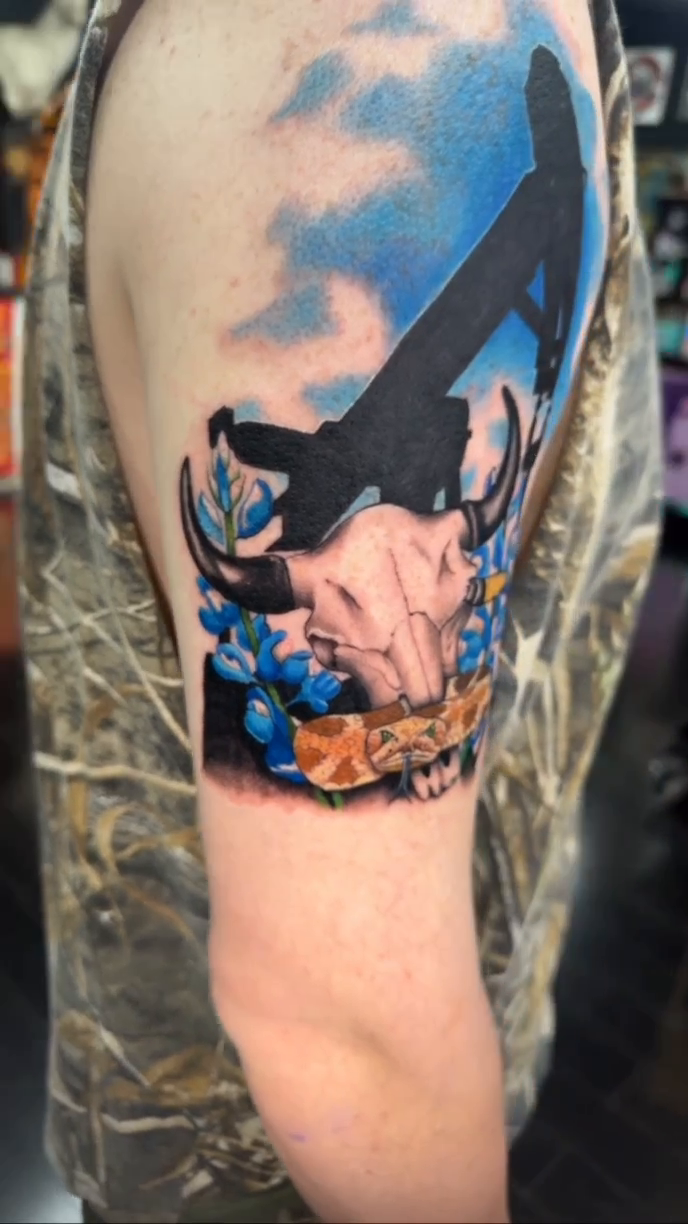Oil derrick and bull skull realism tattoo by Tattoos by Rey G.