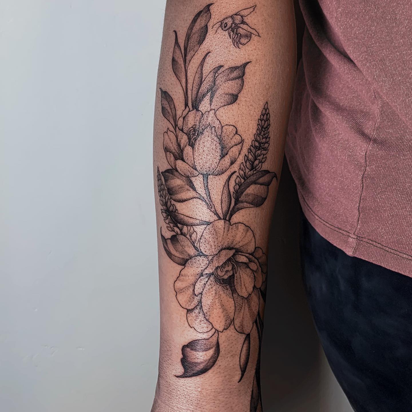 Floral arrangement dotwork tattoo on the forearm by Kolby