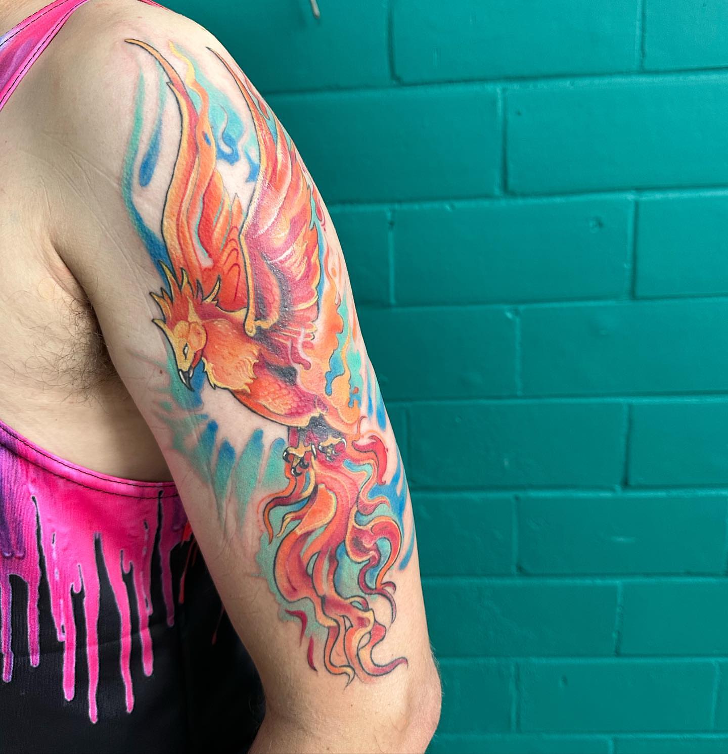 Phoenix new school tattoo on the upper arm by Sarah Bobby, Houston, Texas
