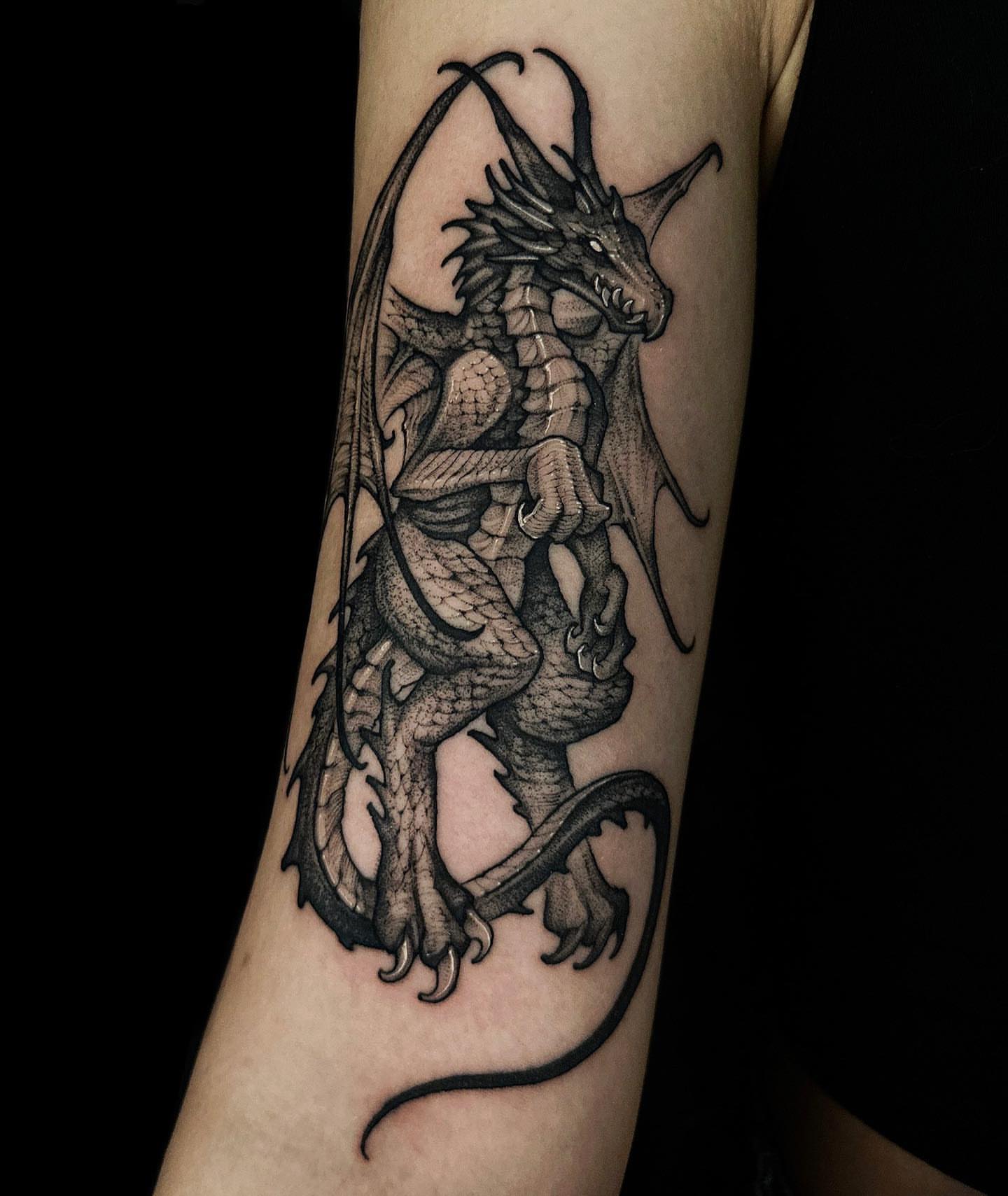 Dragon black and grey tattoo on the forearm by 우레