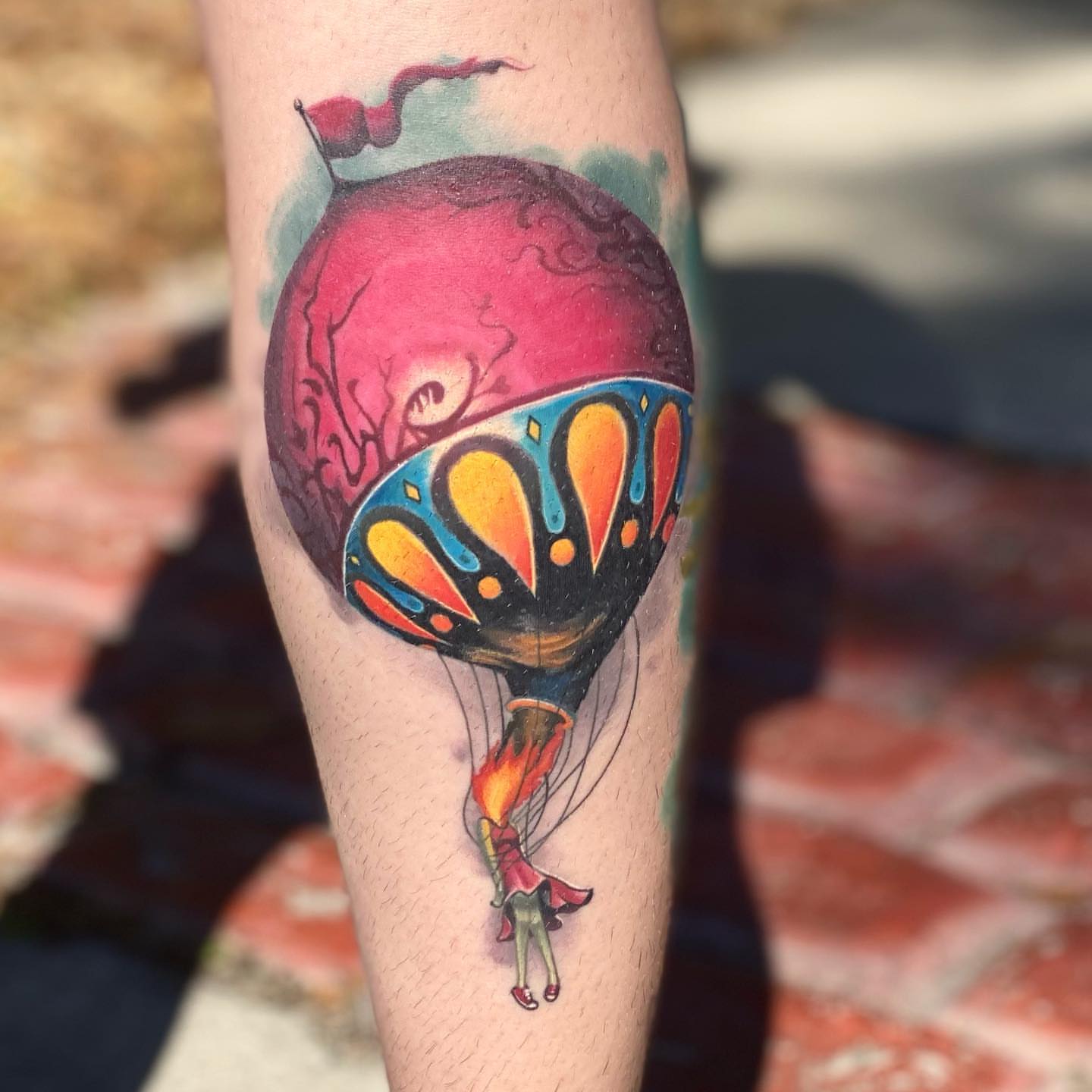 Hot air balloon watercolor tattoo on the forearm by James Boag