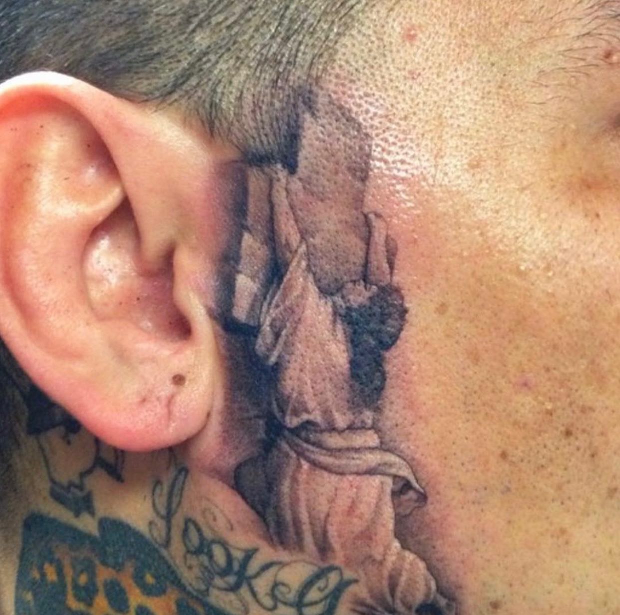 Statue realism tattoo on the neck by Justin Hendrick