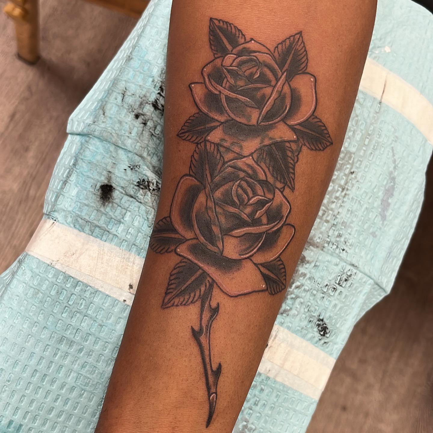 Roses black and grey tattoo on the forearm by Edward A. Boesch