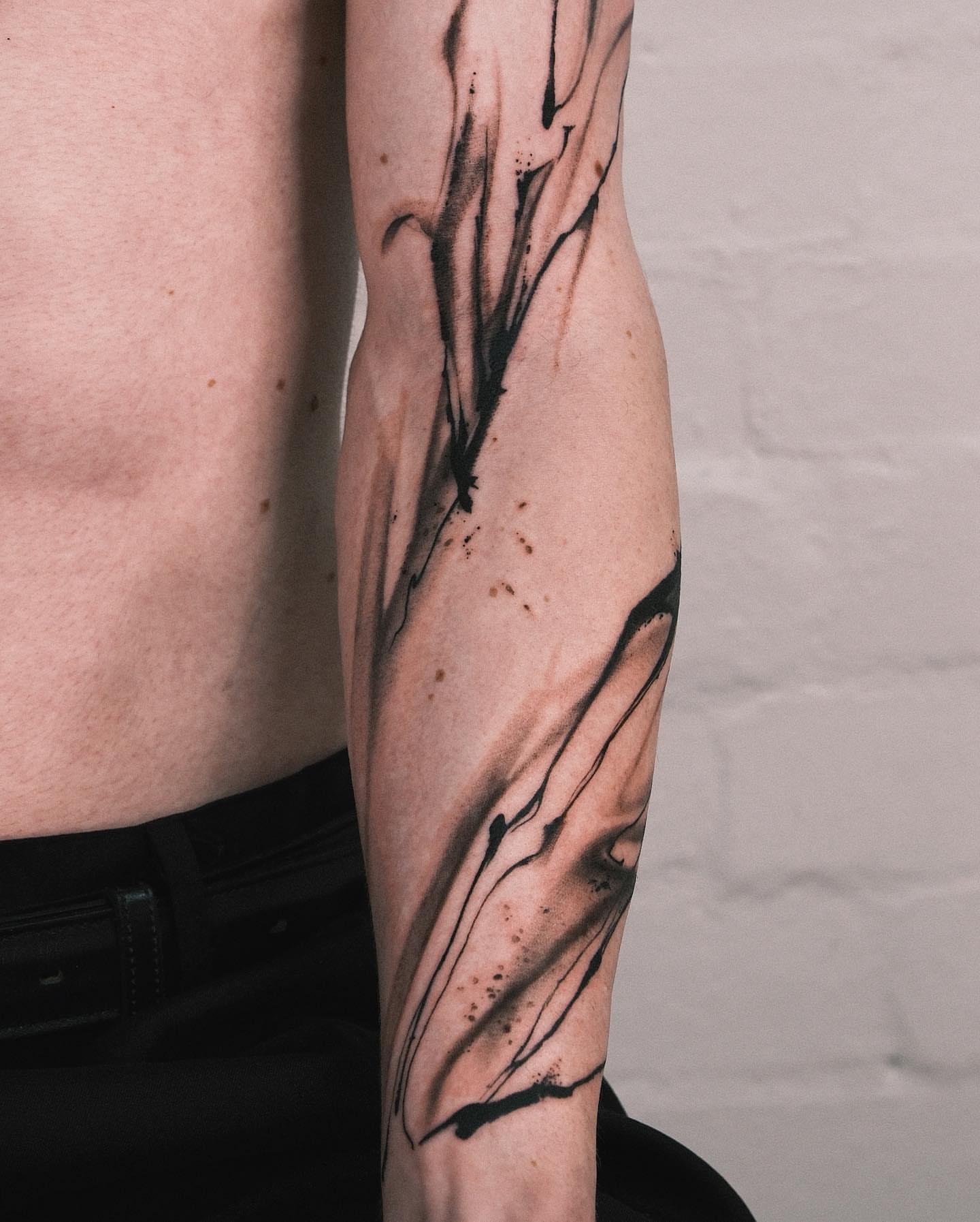 Abstract ink splatter black and grey tattoo on the forearm by Perth tattoo 류, Perth, Western Australia