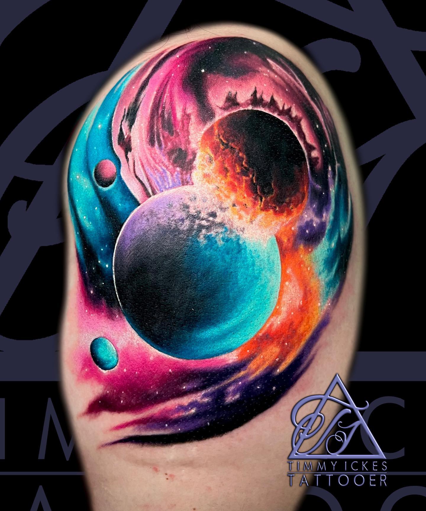Galaxy realism tattoo on the upper arm by Timmy Ickes