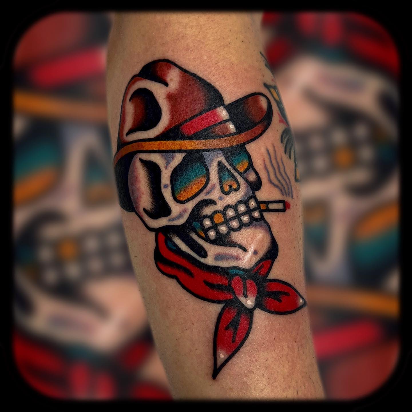 Skull wearing a hat American traditional tattoo on the forearm by Benjamin Ward