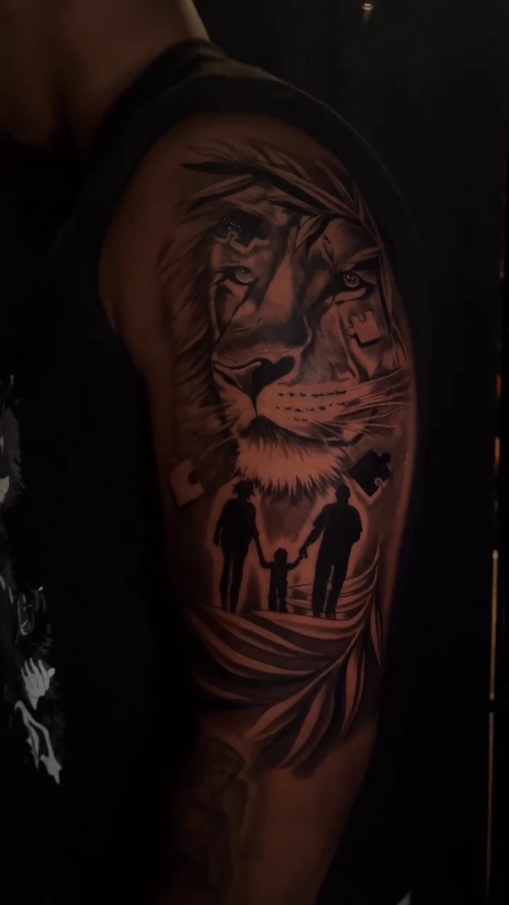 Lion and family silhouette realism tattoo by Miles Johnson