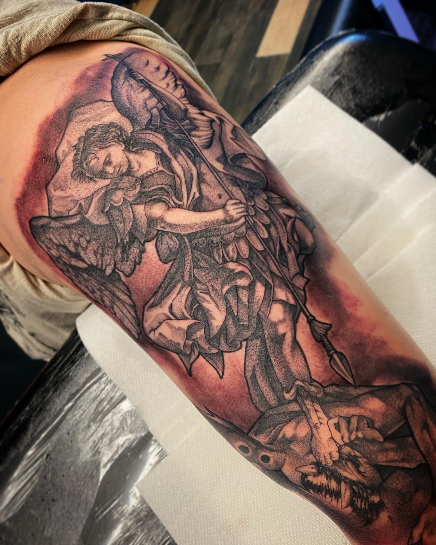 Angel and human figure realism tattoo on the forearm by Angel Rodriguez