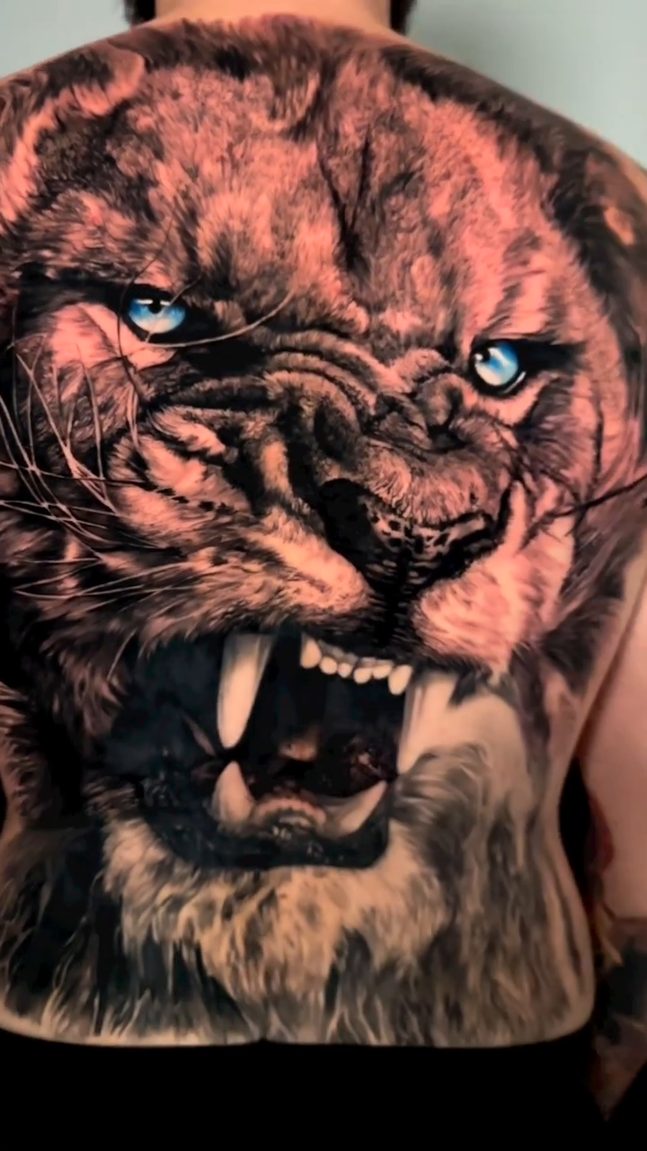 Lion's head realism tattoo by Giuseppe Bonelli