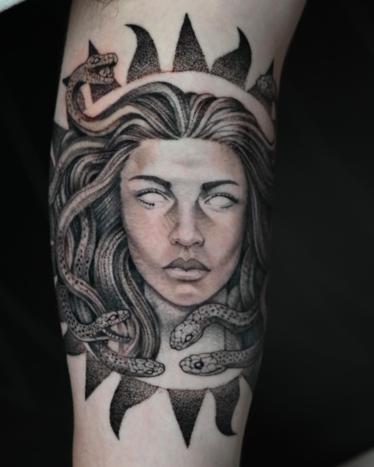 Woman with snakes dotwork tattoo on the forearm by Neri Gersaint