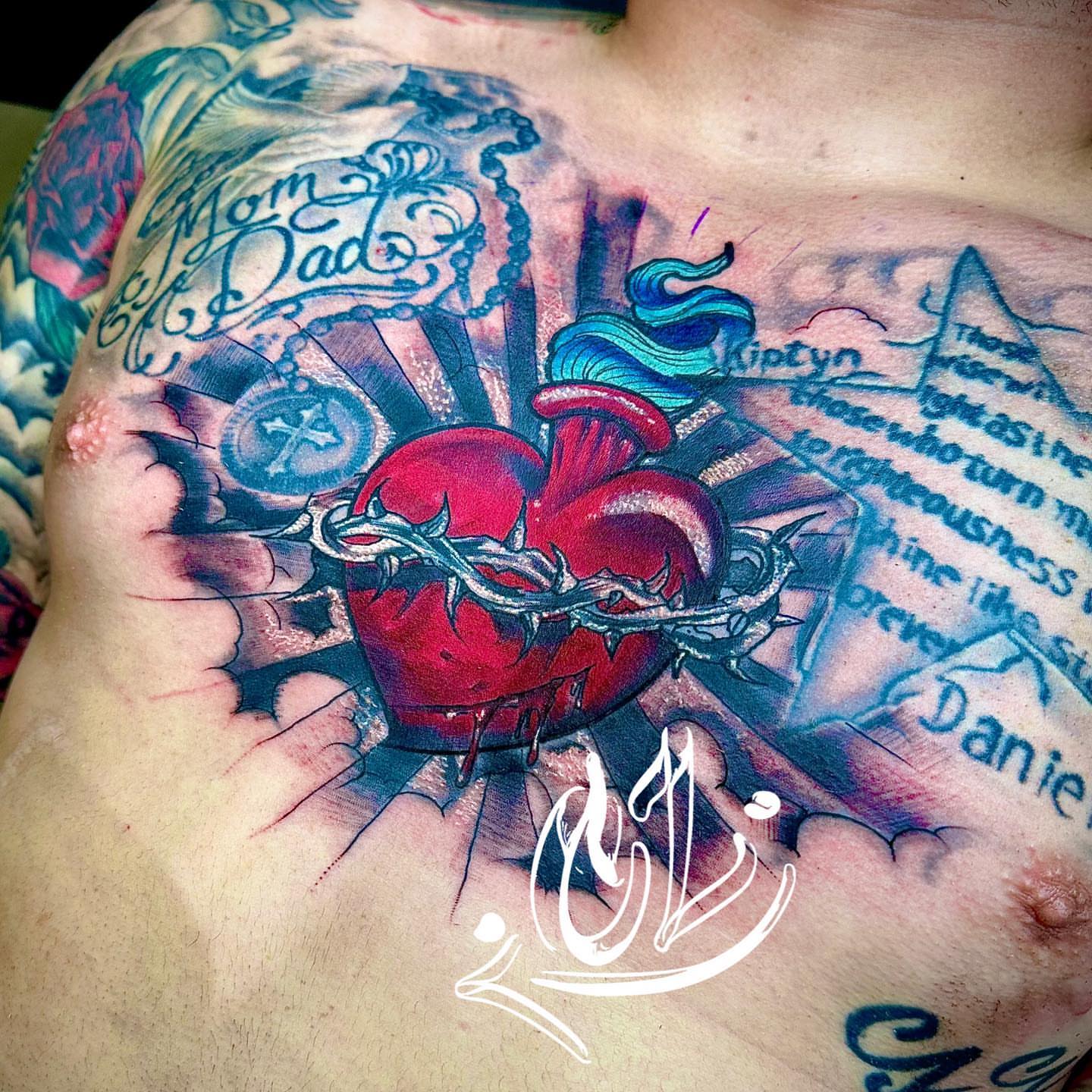 Heart with crown of thorns realism tattoo on the chest by Labbé