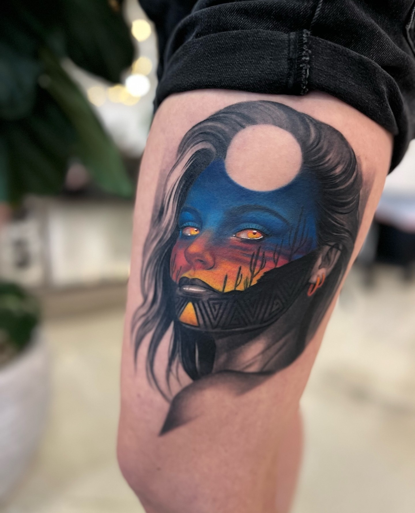Mask-wearing woman realism tattoo on the thigh by Anthony Michaels, Tucson, Arizona