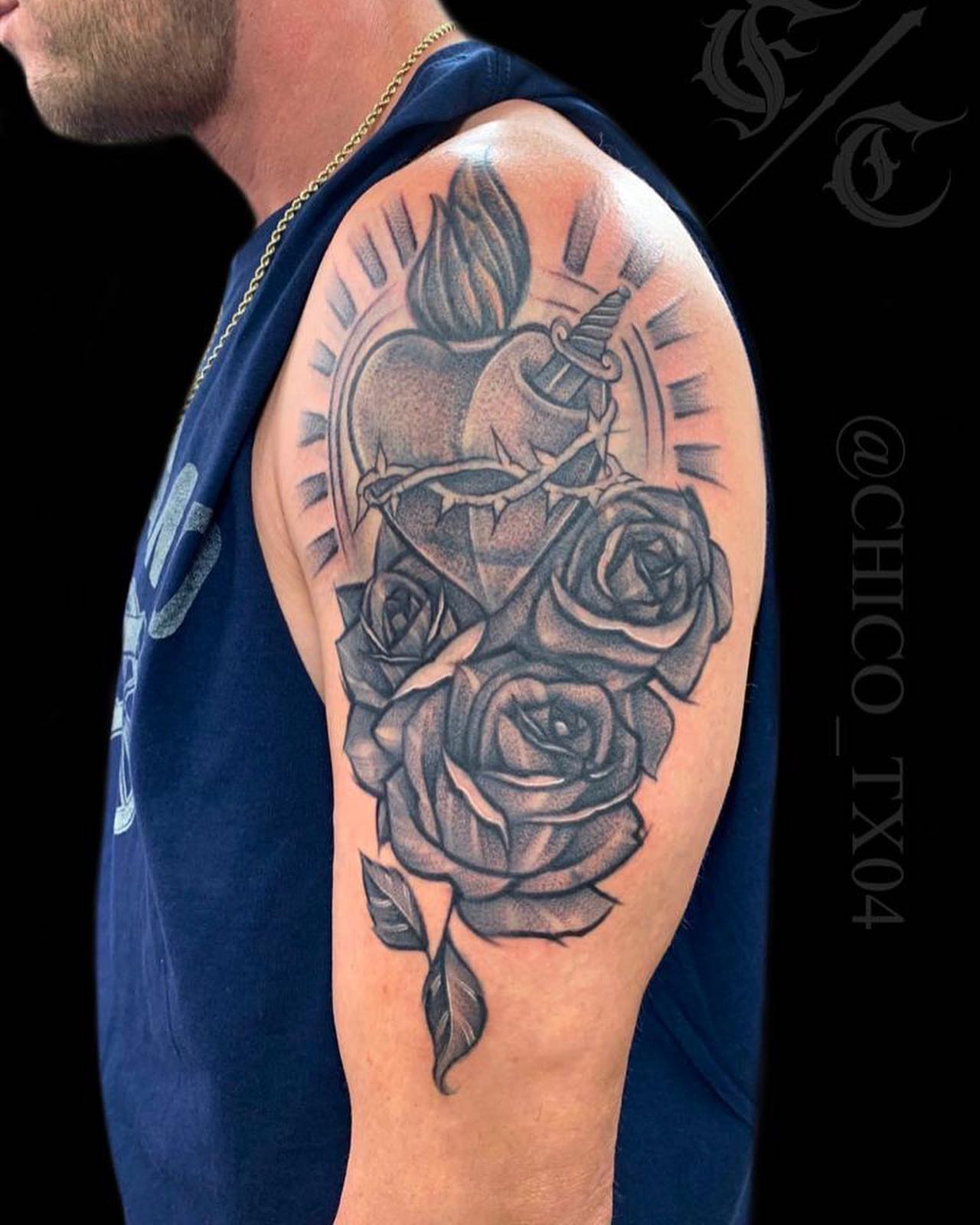 Roses and skull realism tattoo on the shoulder by Tattoos By Chico