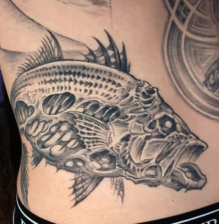 Fish realism tattoo on the ribs by Jason Wheelwright