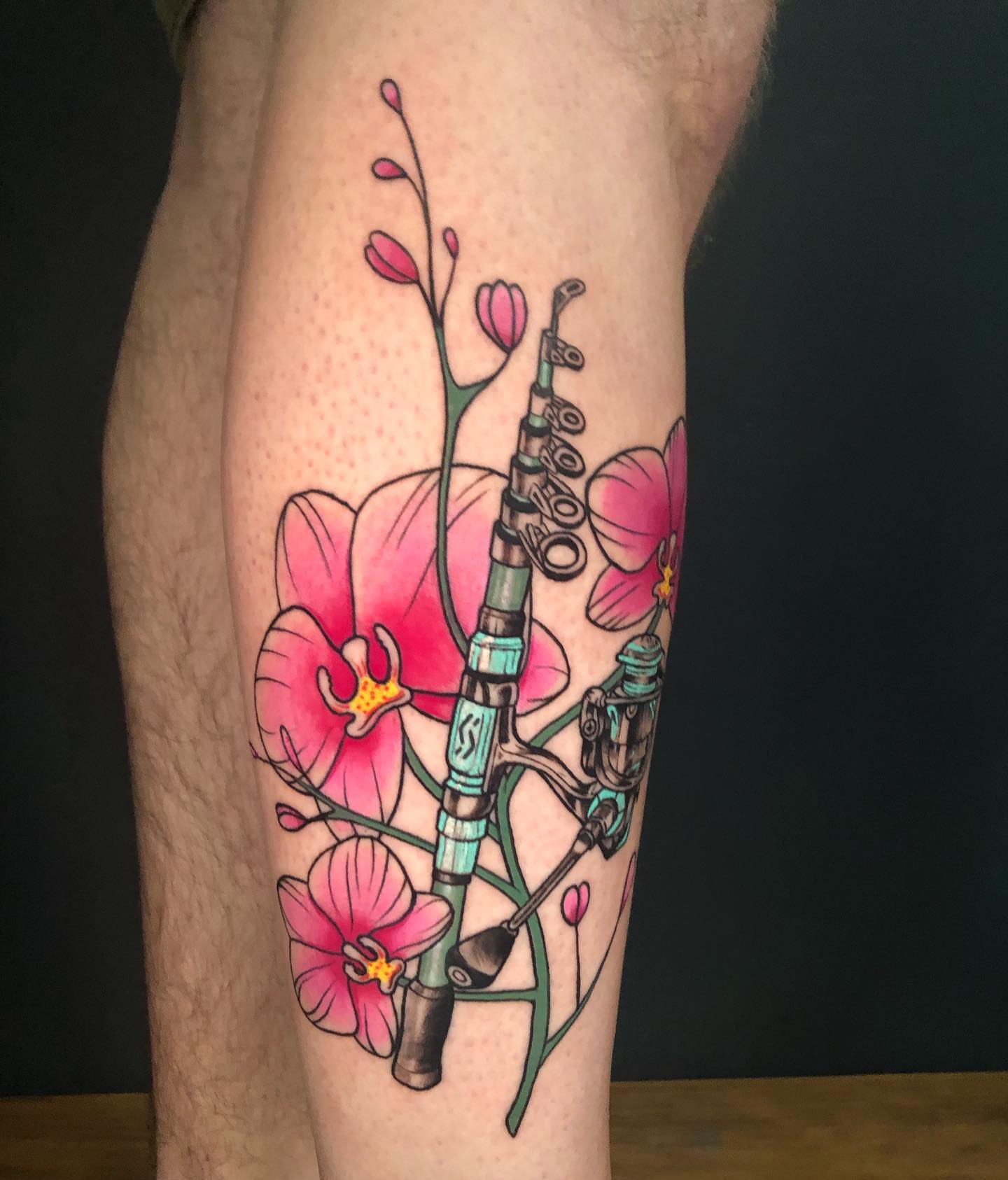 Fishing rod and orchids new school tattoo on the leg by Marta La Jirafa