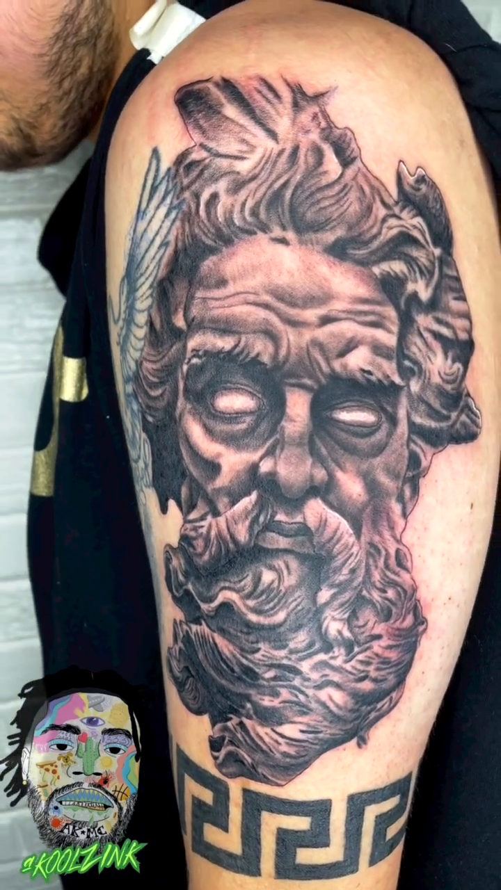 Surrealism tattoo on the upper arm by Koolz