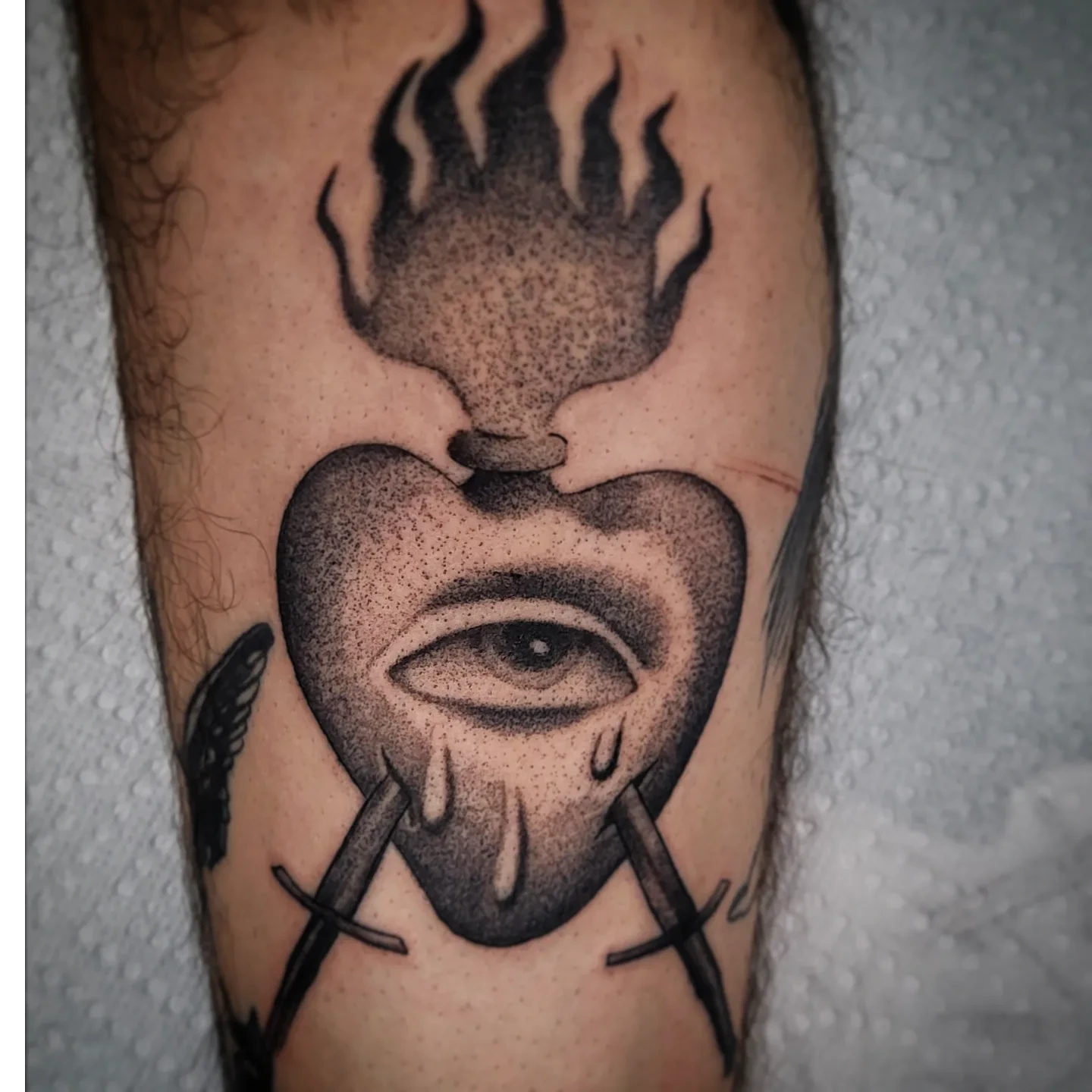 Heart with eye dotwork tattoo on the forearm by TattoosbyPhatboi