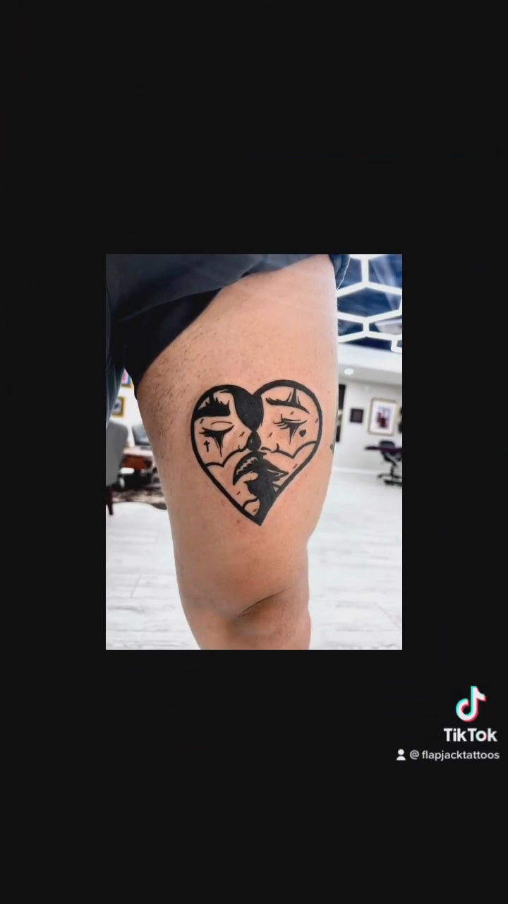 Heart with animal faces blackwork tattoo by Ashley Fino, Las Vegas, Nevada