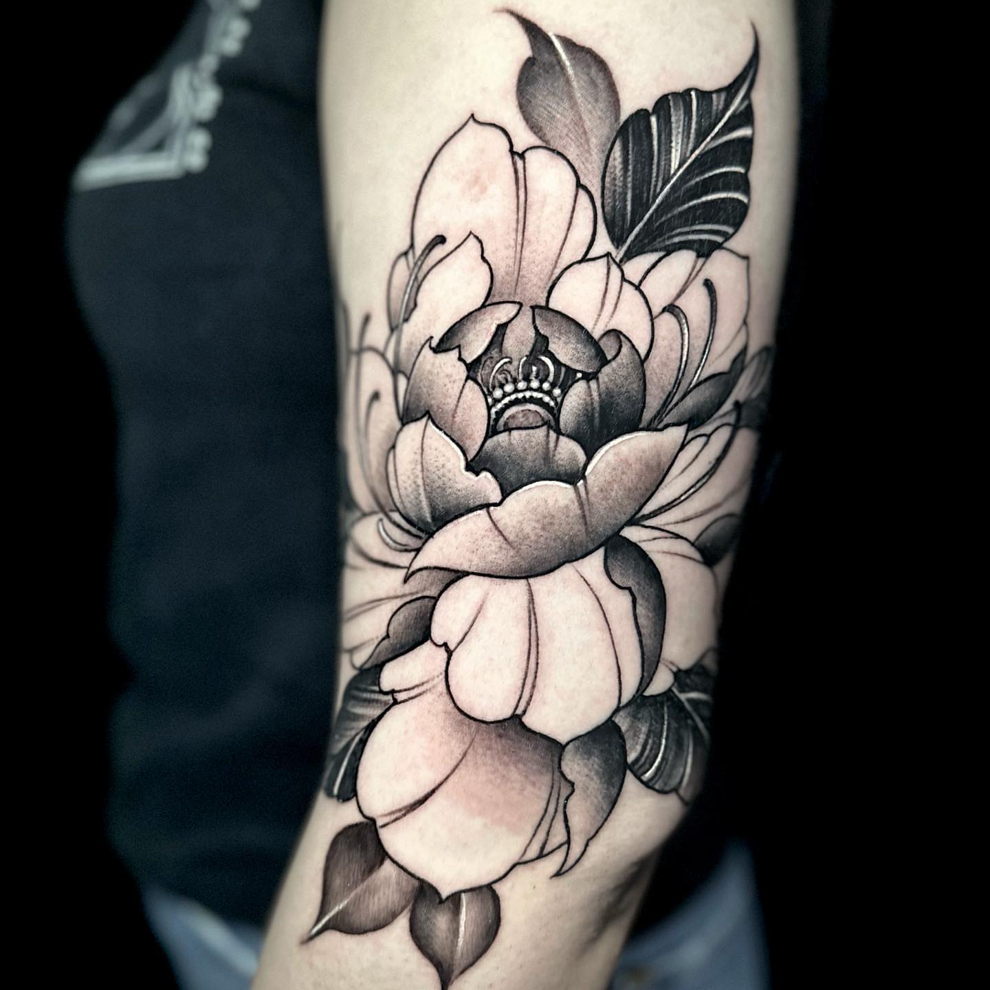 Peony flower black and grey tattoo on the forearm by Gabe Jensen