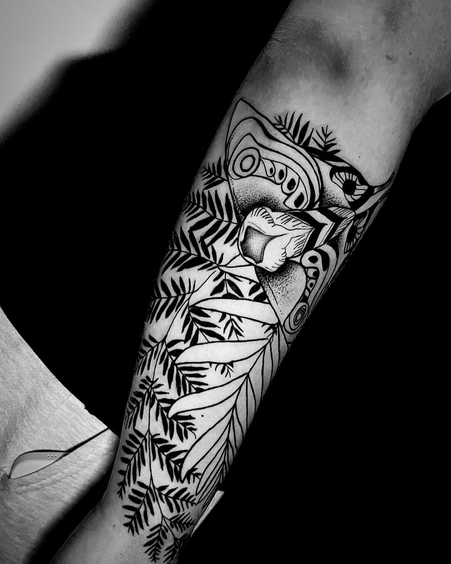 Feather and mask geometric tattoo on the forearm by ๐ธ๐๐๐.๐ฎ๐, Los Angeles, California