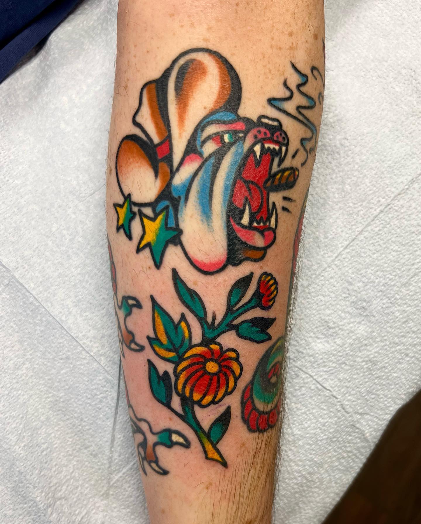 Monster and flowers American traditional tattoo on the forearm by Nicholas Mella, Nashville, Tennessee