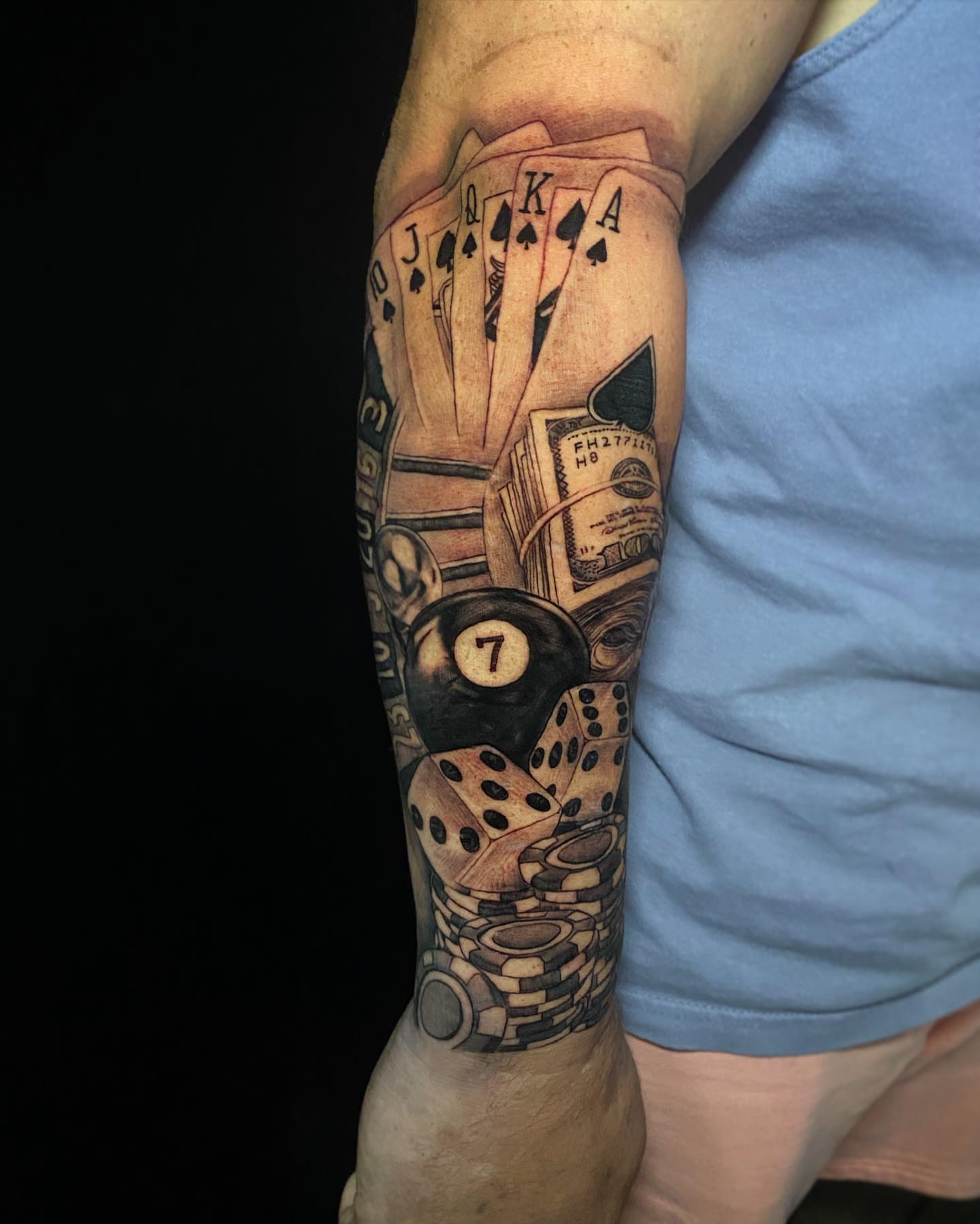 Playing cards and dice black and grey tattoo on the forearm by "CAM", West Palm Beach, Florida