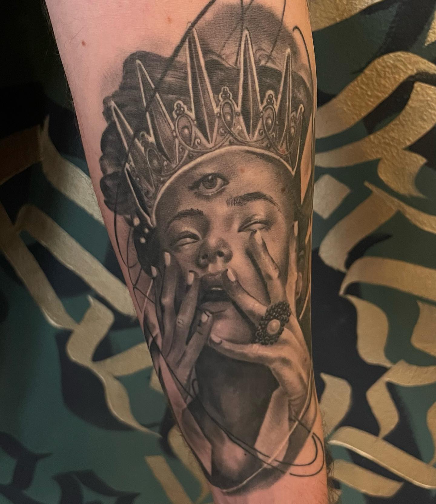 Queen realism tattoo on the forearm by mike hudson
