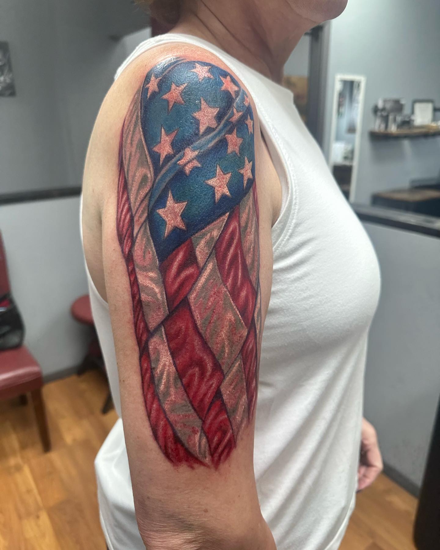 American flag American traditional tattoo on the upper arm by KJ