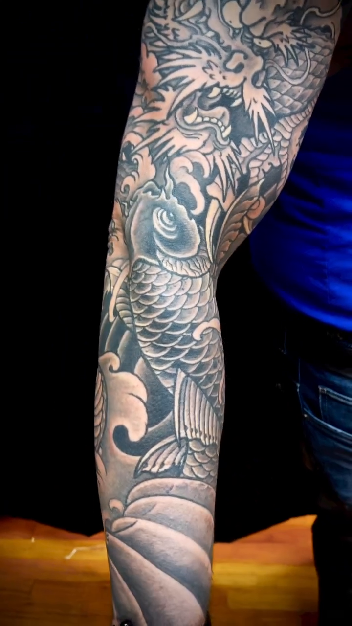Dragon and koi with waves japanese irezumi tattoo by 𝙉𝙄𝘾𝙆 𝘾𝘼𝙍𝙐𝙎𝙊, New York, New York