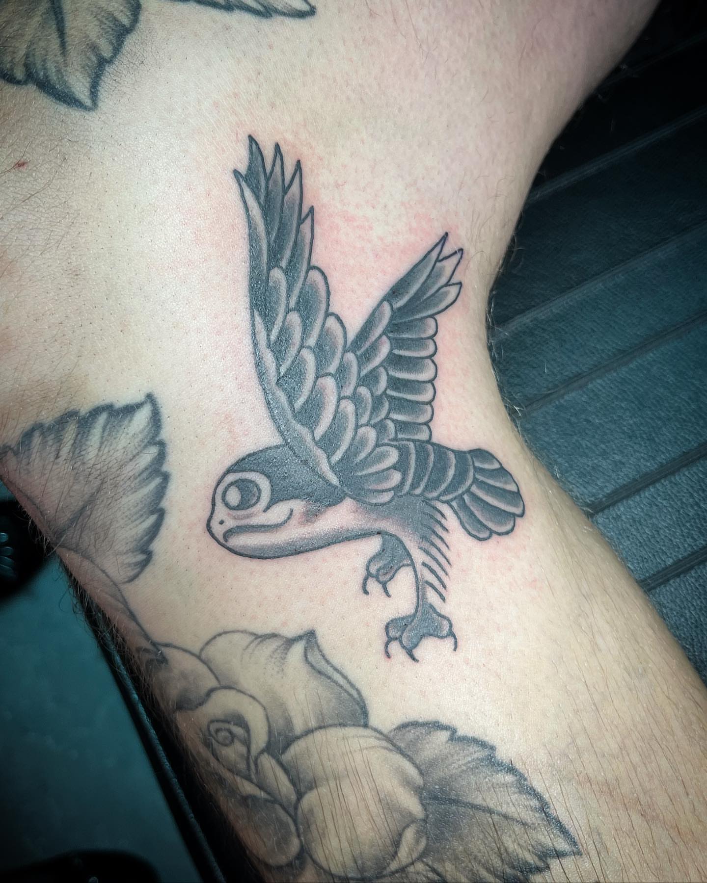 Bird black and grey tattoo on the forearm by alexandra