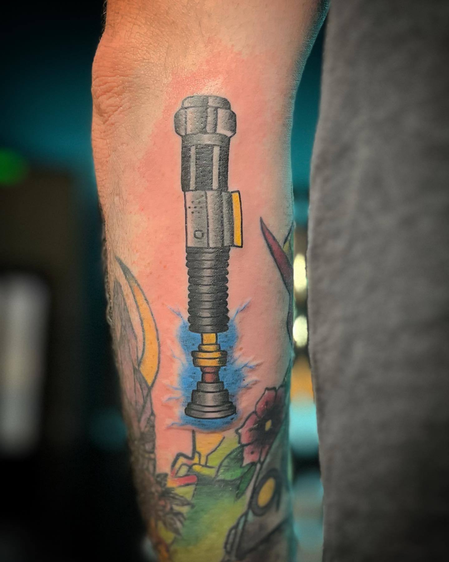 Torch realism tattoo on the forearm by alexandra