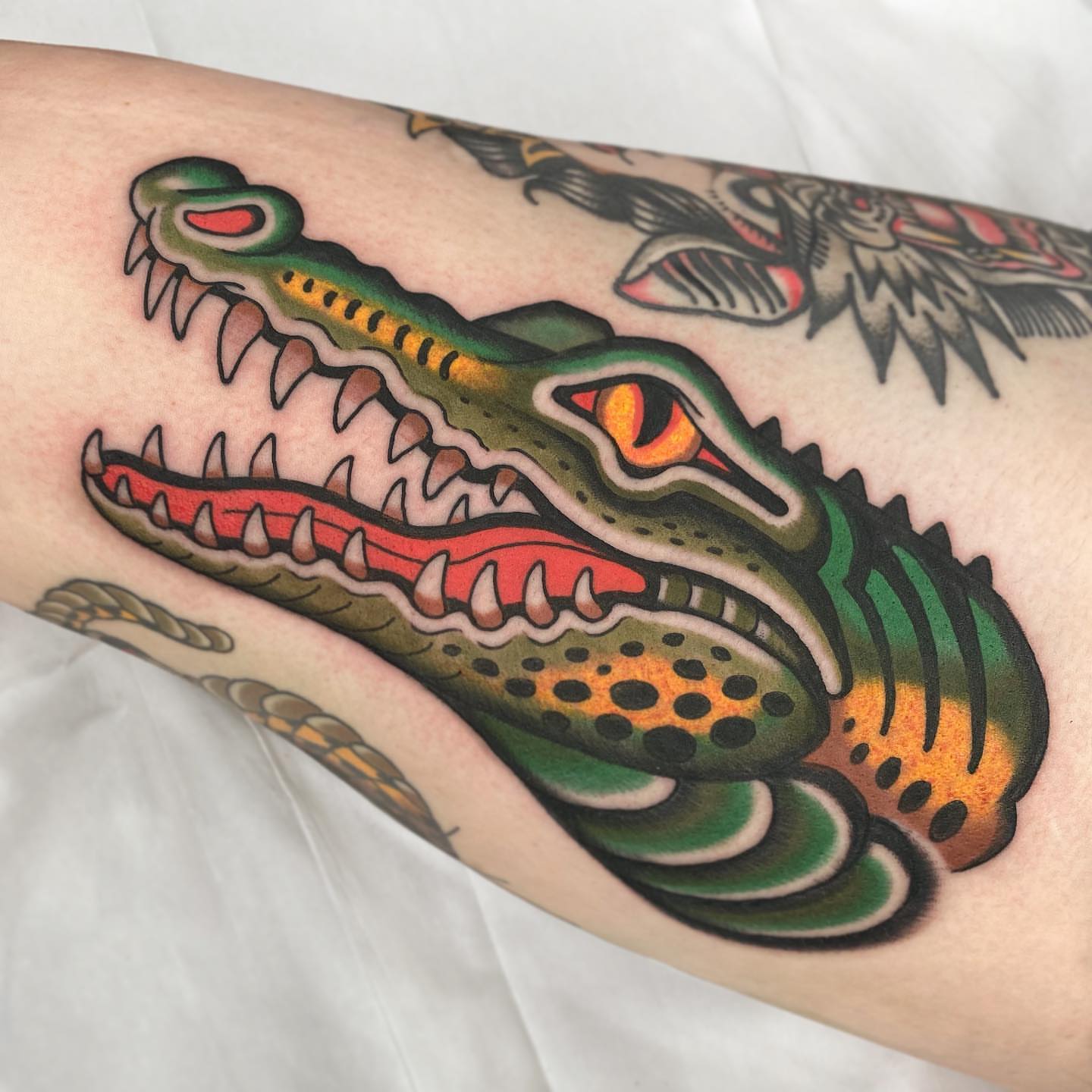 Alligator American traditional tattoo on the forearm by Wes Hoffman
