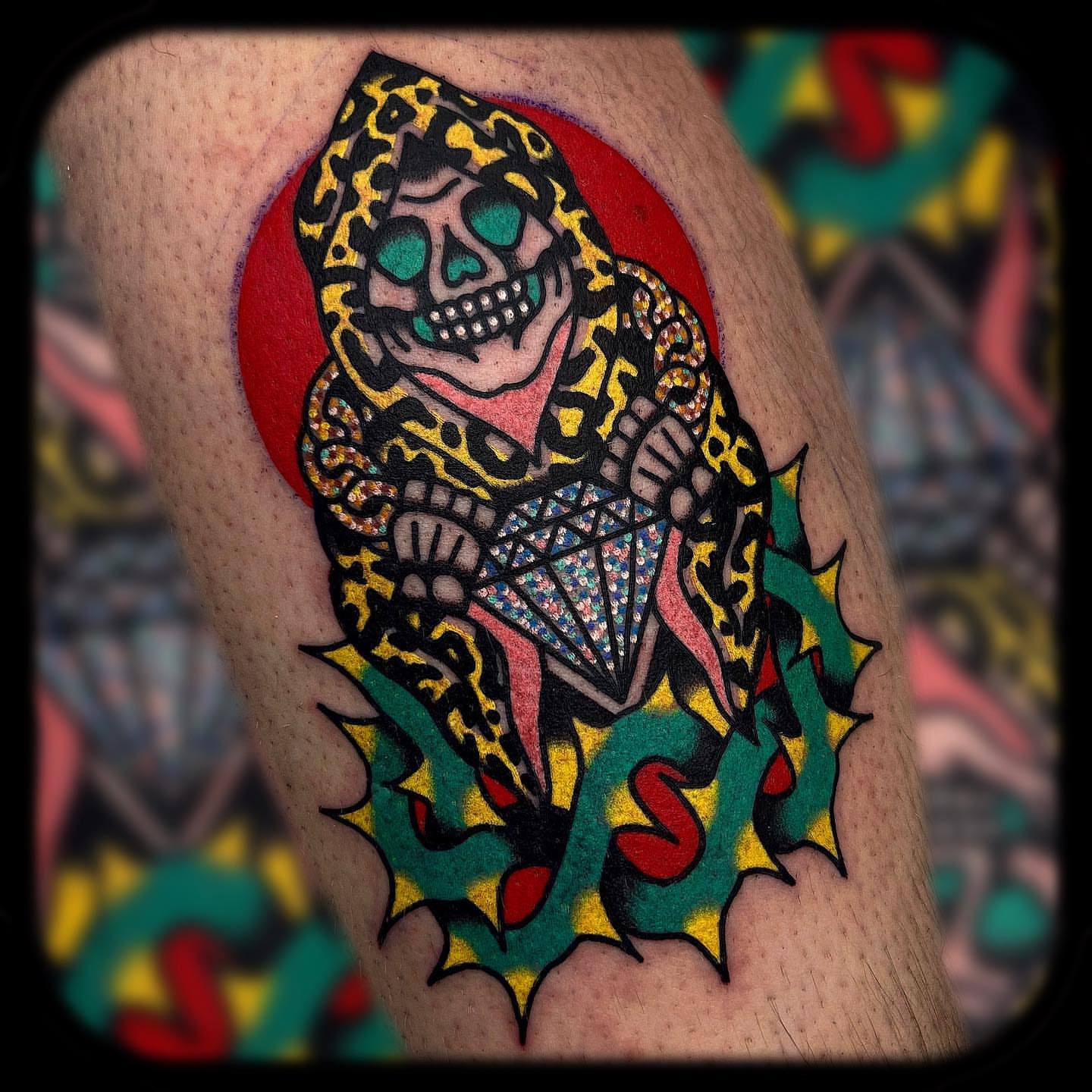 Skull wearing hood American traditional tattoo on the thigh by Benjamin Ward