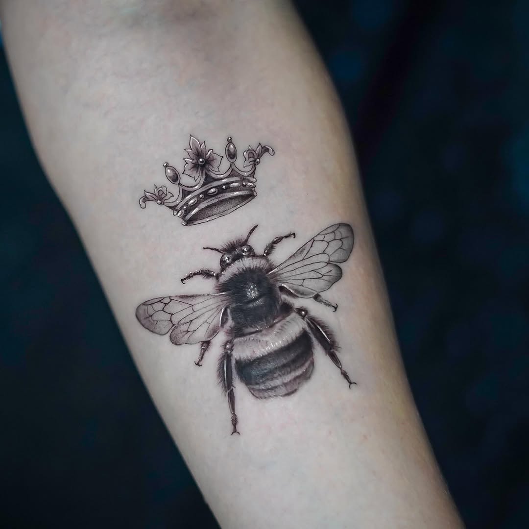 Bee and crown fine line tattoo on the forearm by James Jurado